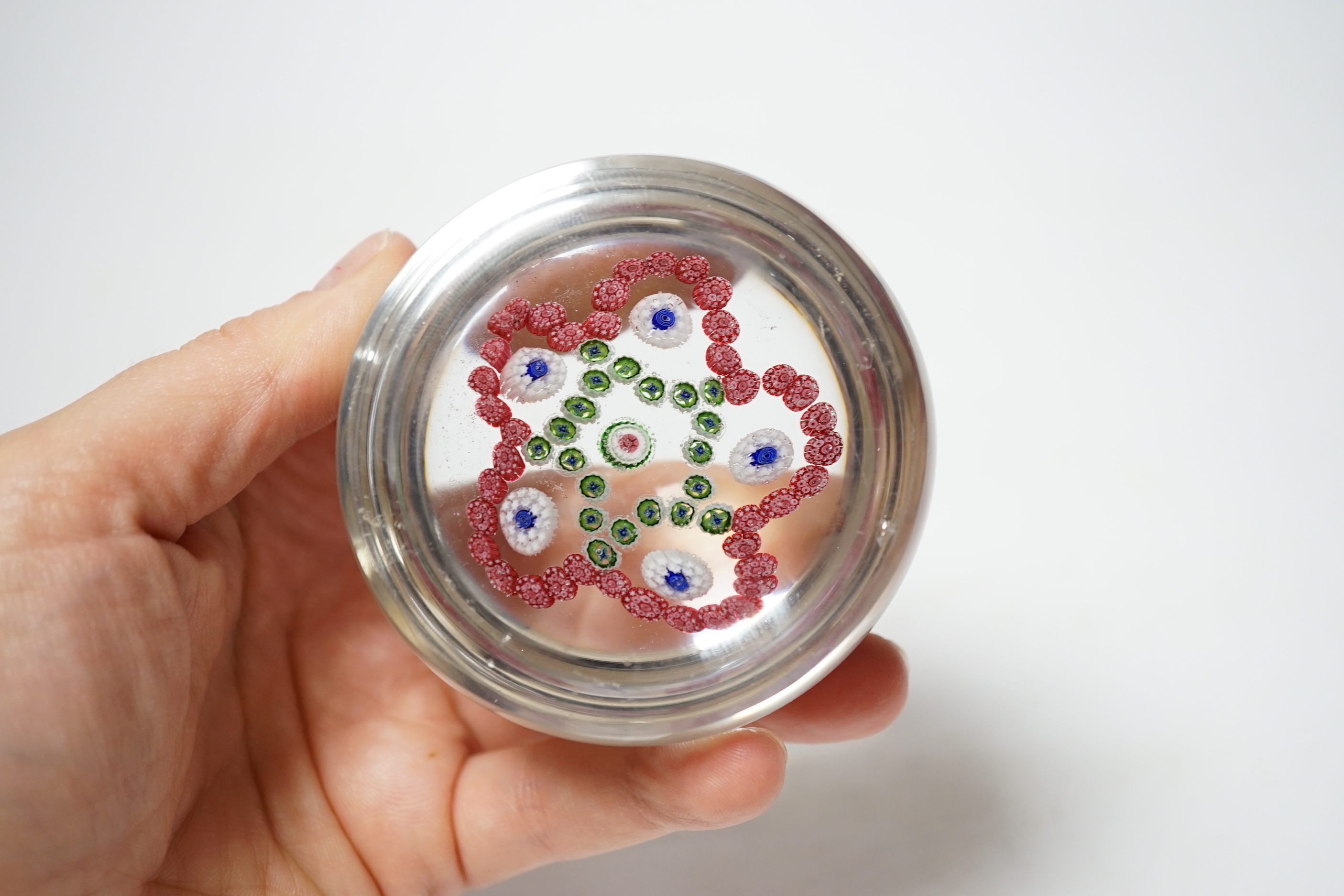 A Baccarat garlands glass paperweight, 7cm diameter